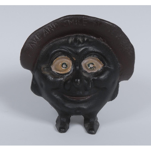 3056 - A Chamberlin & Hill cast iron ''Save and Smile Money Box'', as a large head with wide eyes, wear... 