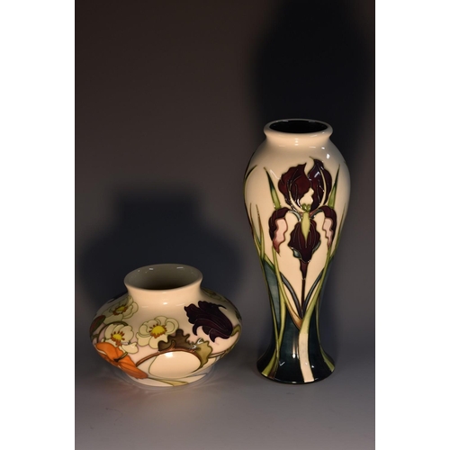 3003 - A contemporary Moorcroft Iris pattern slender baluster vase, tube lined with tall purple irises, on ... 