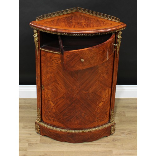 3 - A French Louis XVI Revival gilt metal mounted kingwood and marquetry corner floor cabinet, pierced g... 