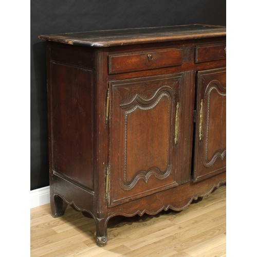 64 - An 18th century Continental oak half cabinet, rounded rectangular top above a pair of frieze drawers... 