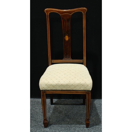 65 - A set of three Sheraton Revival design side chairs, each pierced rectangular splat centred by an ova... 