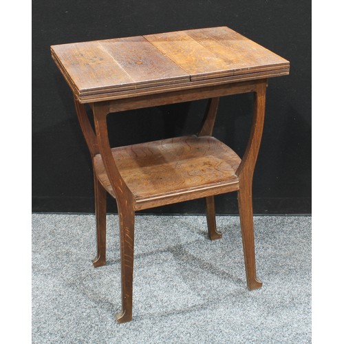 70 - An unusual Aesthetic period oak fold-out occasional table, the rectangular top with twin-hinged cove... 