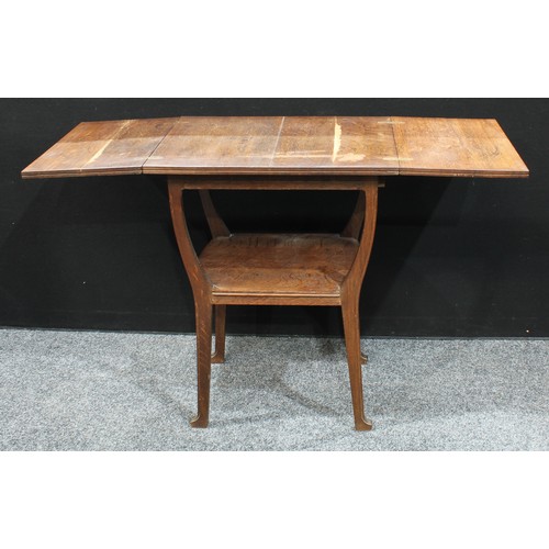 70 - An unusual Aesthetic period oak fold-out occasional table, the rectangular top with twin-hinged cove... 