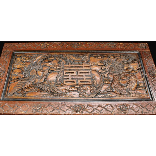 71 - A Chinese inspired hardwood blanket chest, profusely applied with dragons, birds, character marks, f... 