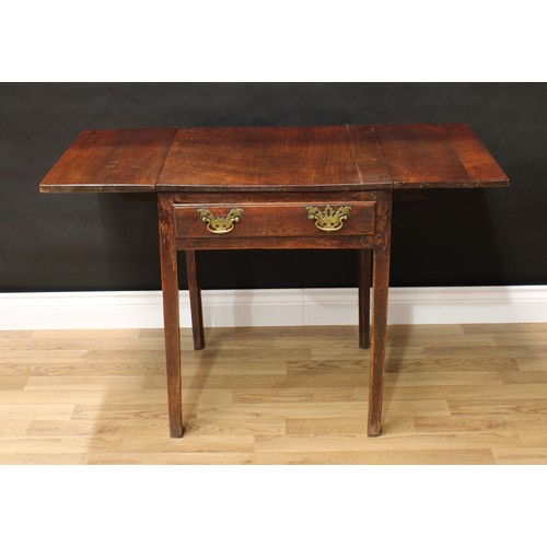 76 - A 19th century oak vernacular dropleaf table, rectangular top above a frieze drawer, brass bat shape... 