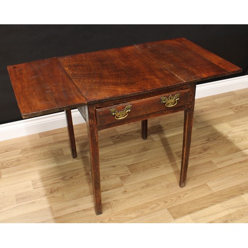 76 - A 19th century oak vernacular dropleaf table, rectangular top above a frieze drawer, brass bat shape... 