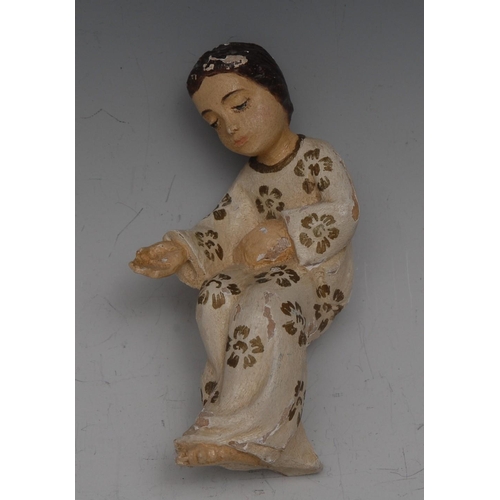 106 - An Italian carved, gesso and polychrome painted figure of serene infant, 12cm high