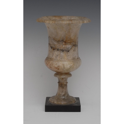 113 - A Derbyshire fluorspar campana vase, probably Crich, shallow centre girdle, turned socle, square bla... 