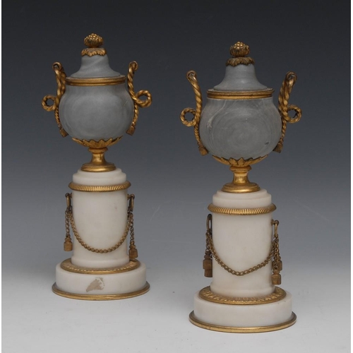 114 - A pair of 19th century gilt metal mounted marble castlettes, domed reversible covers with bud finial... 