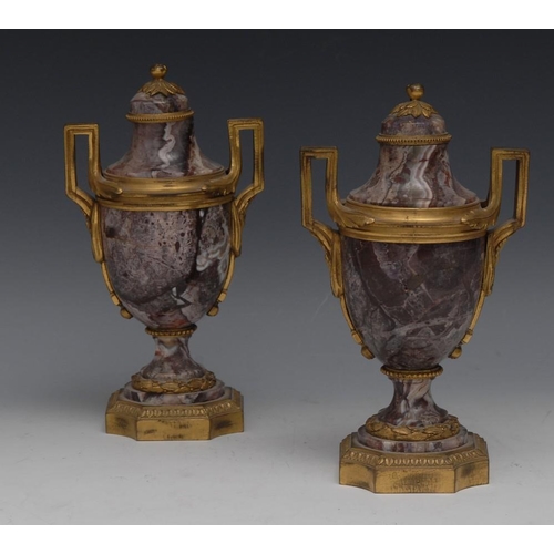 116 - A pair of Louis XVI Revival ormolu mounted Breccia marble ovoid mantel urns, angular scroll handles ... 