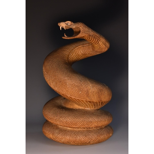 3322 - An Indian sandalwood carving, of a coiled cobra, the snake hissing ferociously, 22.5cm high, c.1900