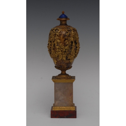 120 - A post-Regency ormolu mounted Derbyshire spar ovoid mantel urn, lapis lazuli finial, applied with ri... 