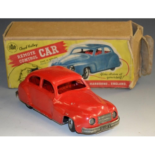 5073 - A Chad Valley remote control clockwork pump action steering tin plate saloon car, red body and inter... 