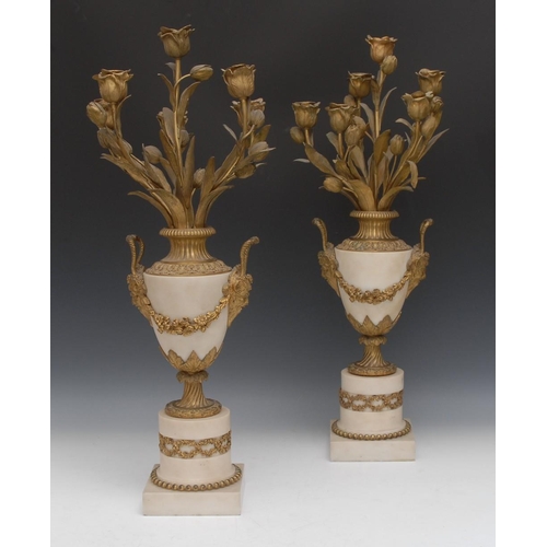 126 - A pair of 19th century ormolu mounted Carrara marble ovoid pedestal urnular six-light candelabra, th... 