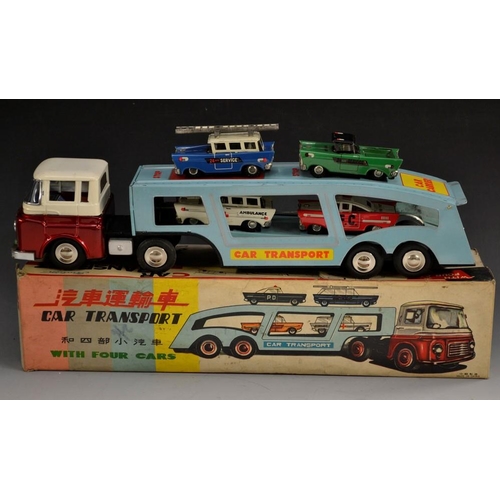 5085 - A Chinese Tinplate Car Transporter and Four Cars, red/white cab, light blue tin printed back, ambula... 