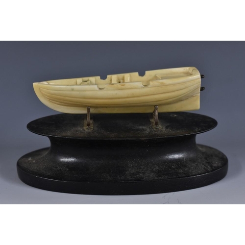 3408 - Marine Folk Art - an early 19th century whale tooth carving, of an open boat, 8.5cm long