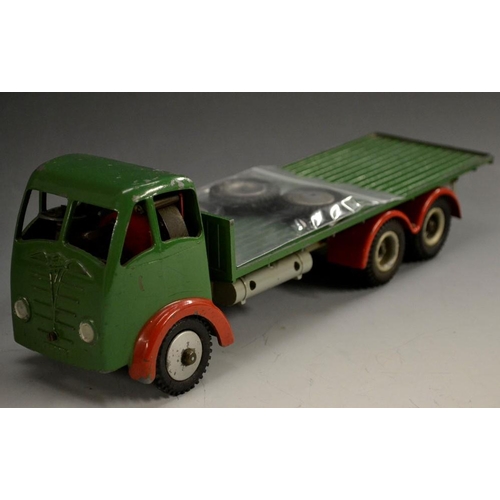 5088 - Shackleton Toys - a clock work model of a Foden flat bed lorry, green body,  red wheel arches, silve... 