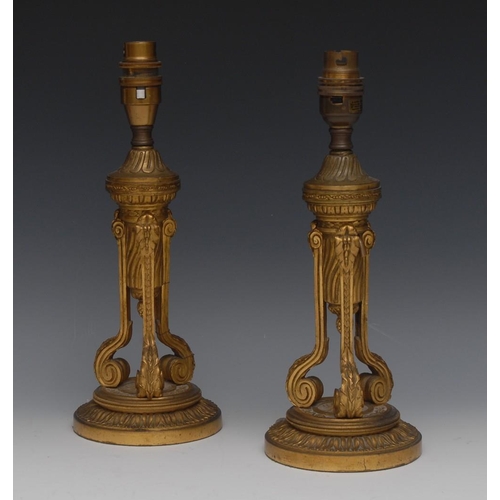 127 - A pair of 19th century ormolu table lamps, tripod columns, circular bases, cast throughout with lotu... 