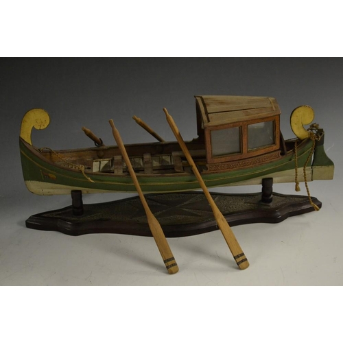 5093 - A scratch built model of a Maltese Dghajsa passenger rowing boat, arched scroll terminal crests, gre... 