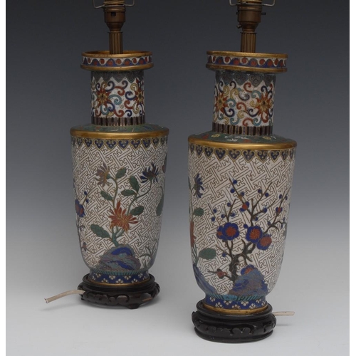 128 - A pair of Chinese cloisonne enamel roulade vases, mounted as lamps, decorated in polychrome with blo... 