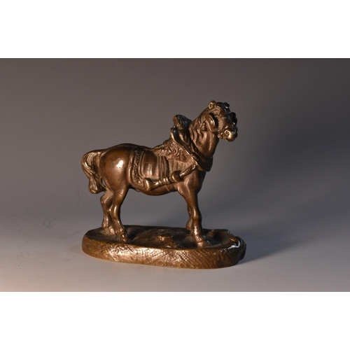 3434 - French School (19th century), a dark patinated bronze, of a horse in harness, oval base, 8cm long