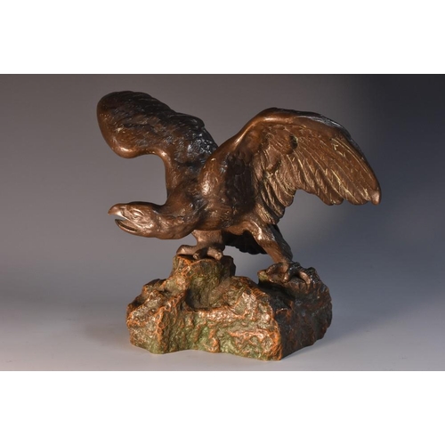 3436 - French School (early 20th century), a dark patinated bronze, of an eagle on a rocky outcrop, 15.5cm ... 