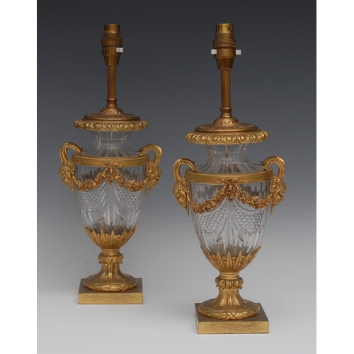 132 - A pair of Neo-Classical design gilt metal mounted hobnail-cut clear glass urnular table lamps, possi... 