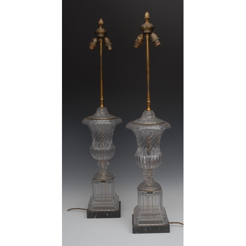 135 - A pair of substantial George III style clear glass campana table lamps, lofty fittings with bud fini... 