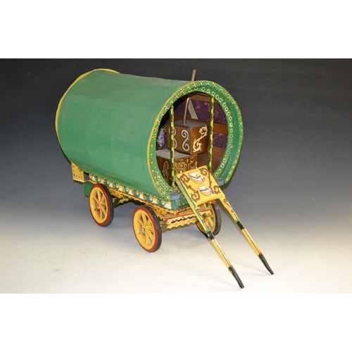 5276 - A scratch built model of a Romani caravan, wooden green painted body elaborately painted with multi-... 