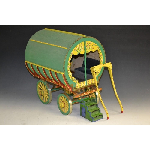 5277 - A scratch built model of a Romani caravan, wooden green painted body elaborately painted with multi-... 