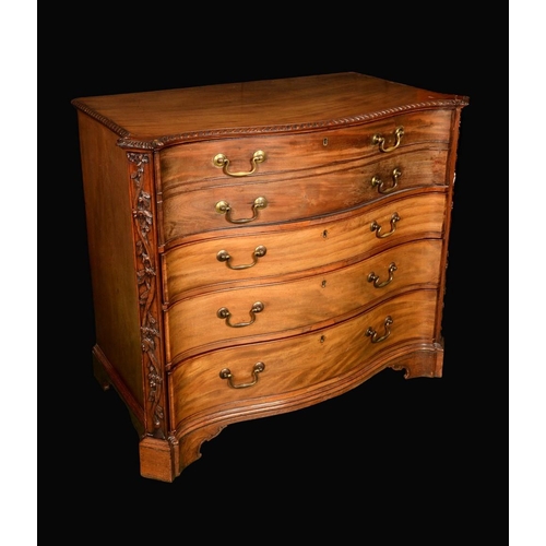 148 - A George III mahogany canted serpentine secretaire chest, oversailing gadrooned top above a fall fro... 