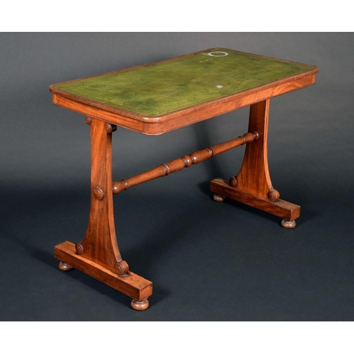 153 - A George IV mahogany rounded rectangular writing table, slightly oversailing top with inset tooled a... 