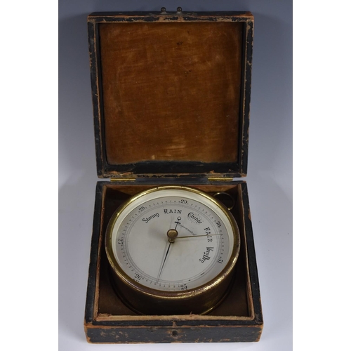 3951 - A 19th century brass travelling aneroid barometer, 11cm silvered register inscribed Compensated, 15c... 