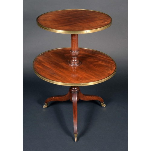 171 - A Regency mahogany circular two-tier dumbwaiter, brass mounted graduated plateaux, turned and fluted... 