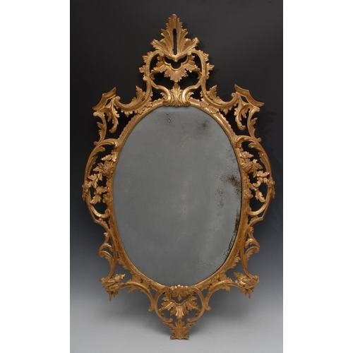 178 - A Rococo giltwood cartouche shaped looking glass, pierced and carved with flowers and leafy scrolls,... 