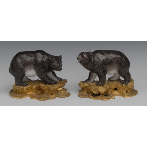4 - A pair of ormolu mounted porcelain models, of bears, in the manner of  Kändler's Meissen, modelled s... 