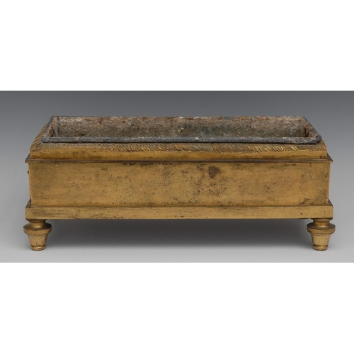 82 - A Regency gilt brass rectangular table jardiniere, lion masks to sides, turned feet, 34cm wide, 19th... 