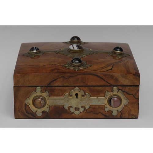 87 - A Victorian agate and gilt brass mounted walnut games box, hinged cover enclosing lift-out trays con... 