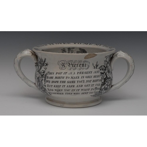 14 - A Staffordshire two-handled chamber pot, the rim inscribed in black For A Kiss I'll Hand You This, H... 