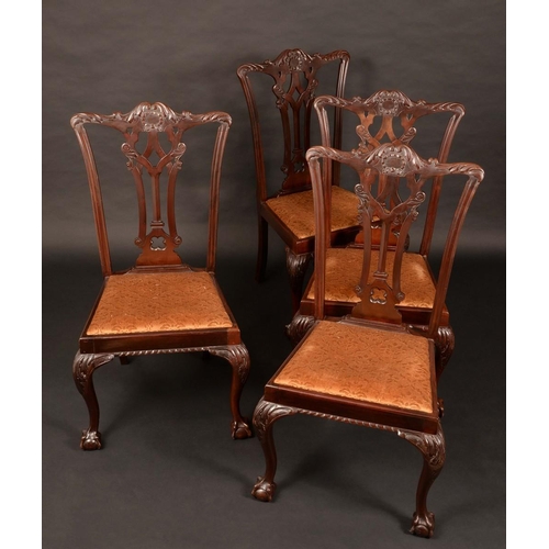 1562 - A set of four Chippendale Revival mahogany dining chairs, shaped cresting rails carved with scrollin... 