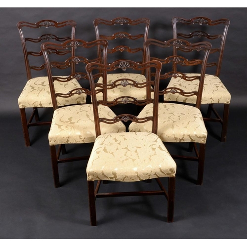 1566 - A set of six George III Revival mahogany dining chairs, serpentine ladder backs pierced and carved w... 