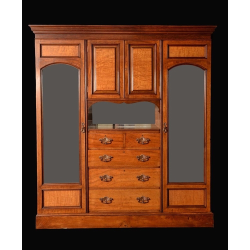 1567 - A Victorian Irish pollard oak compactum wardrobe, by Arthur Jones & Co, Dublin, stamped, stepped cor... 