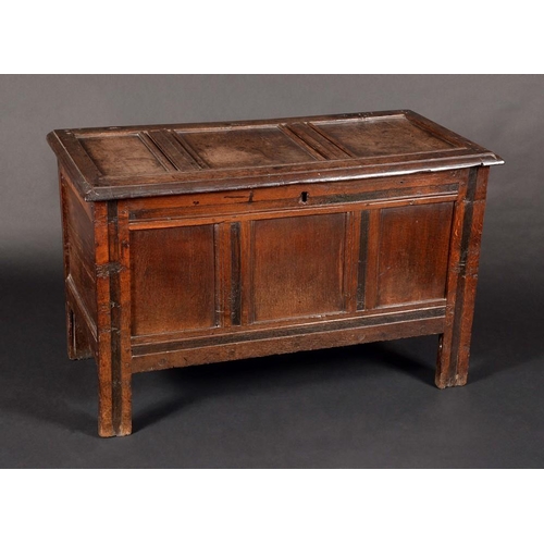 1588 - An early 18th century oak three-panel blanket chest, hinged top, stile feet, 62cm high, 101cm wide, ... 