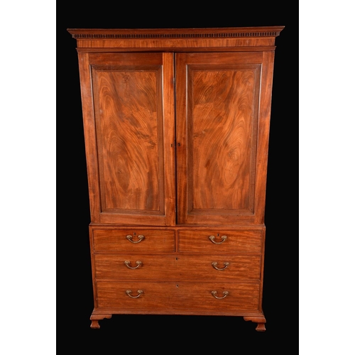 1590 - A Victorian flame mahogany linen press, dentil cornice, crossbanded doors enclosing slides to top, t... 