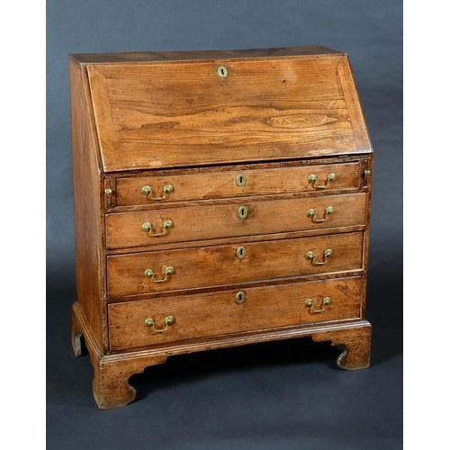 1593 - A George III elm bureau, fall front enclosing a cupboard, pigeon holes and small drawers, above four... 