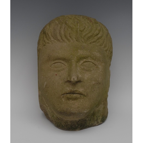 1603 - A stone head, carved hair and features, 21cm high, 19th century