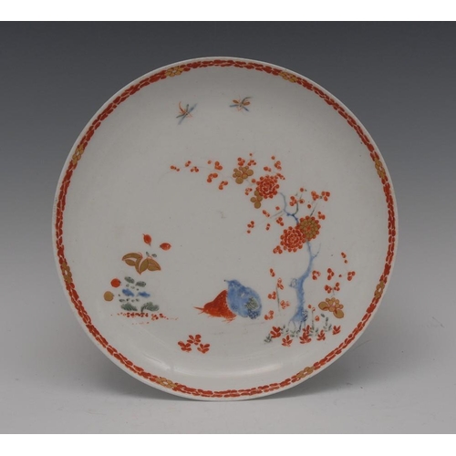 59 - A Bow circular Quail pattern circular plate, painted in the Kakiemon palette, within a leafy iron re... 