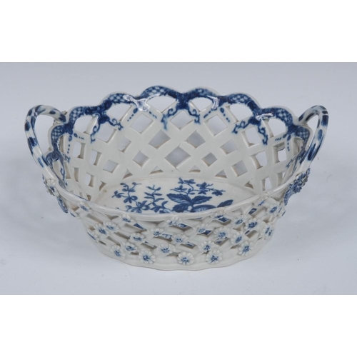 70 - A Worcester Pine-cone pattern shaped oval basket, printed in underglaze blue with peony between two ... 