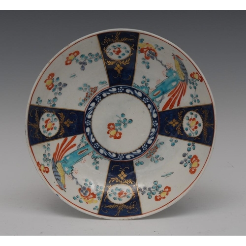 75 - A Worcester Sir Joshua Reynolds pattern saucer, decorated with alternating panels, with a Kakiemon s... 