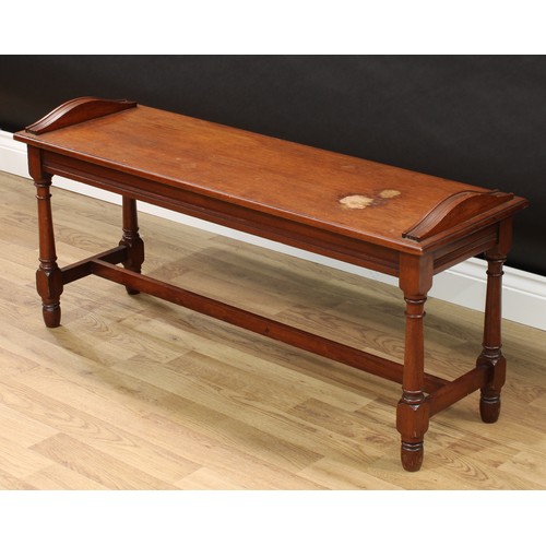 133 - A Victorian mahogany window seat, rectangular top with arched reeded ends, turned legs, H-stretcher,... 